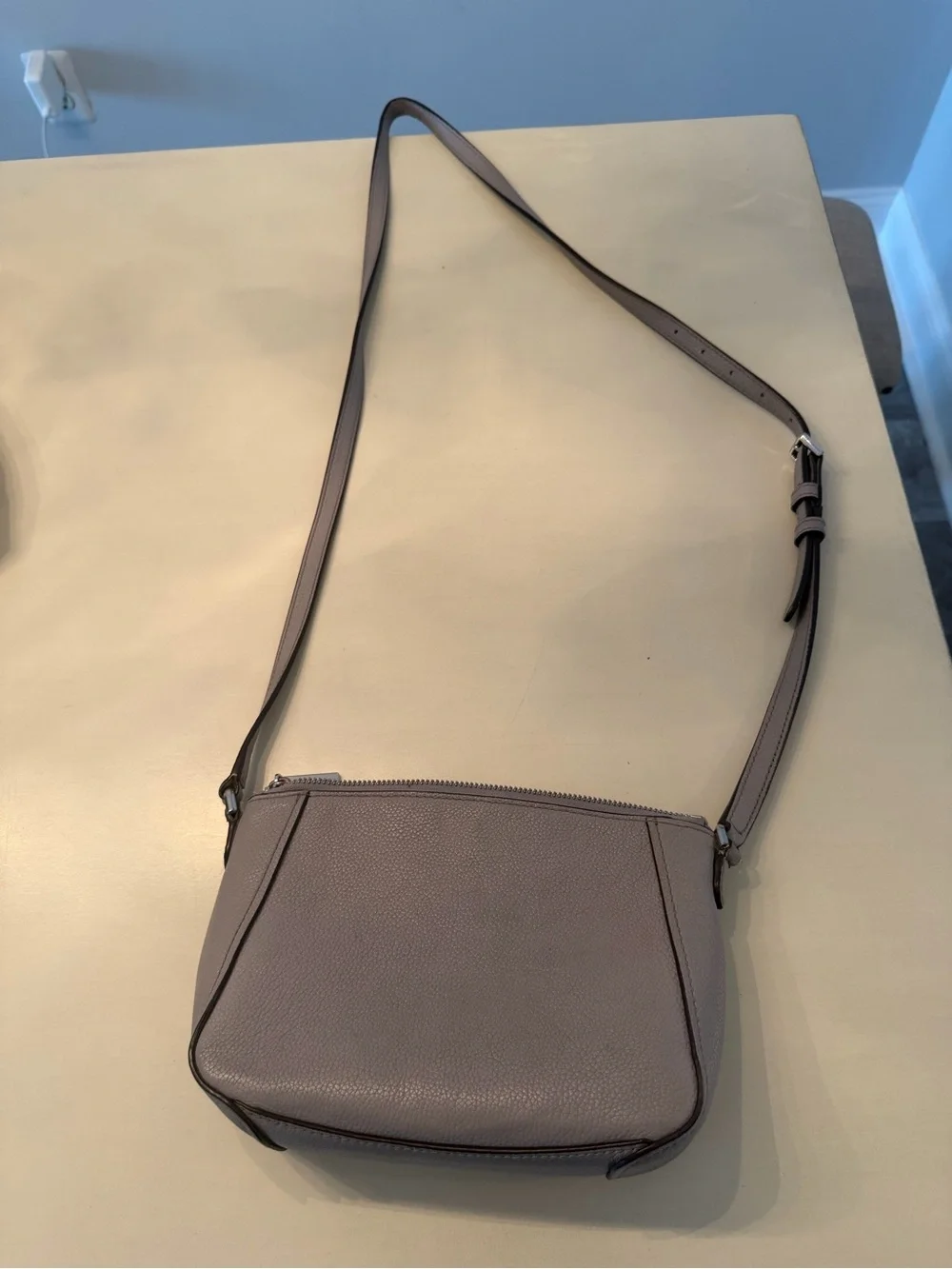 kate spade gray pebbled leather crossbody with floral logo